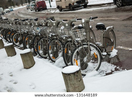 PARIS - MARCH 13: Velib bicycles in snow as seen on March 13, 2013 in Paris, France. Velib is a public bicycle sharing system in Paris with over 20,000 bikes.