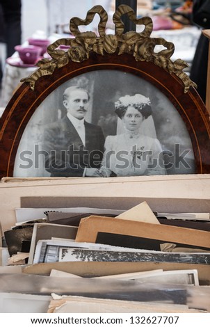 PARIS - MARCH 10: Old black and white photo of  bride and groom at flea market as seen on March 10, 2013 in Paris, France. There more than 20 flea markets in Paris.
