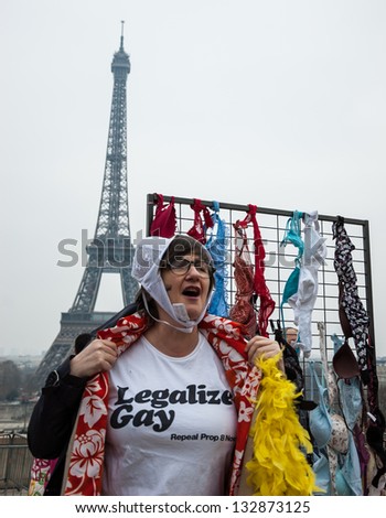 PARIS - MARCH 24: One of participants of flash mob for raising awareness for breast cancer calls also for gay legalize on March 24, 2013 in Paris, France.