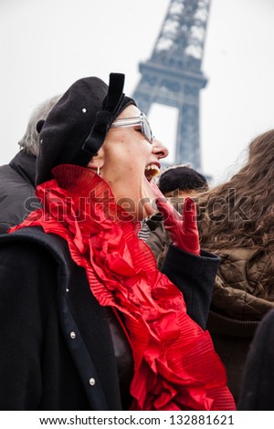 PARIS - MARCH 24: Unrecognizable woman participates in flash mob of Pink bra bazaar in Paris to raise awareness for breast cancer on March 24, 2013 in Paris, France.