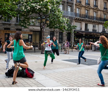 PARIS - JULY 6: Unidentified young women participate in fitness flashmob near Palais de Justice on July 6, 2013 in Paris, France.