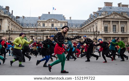PARIS - DECEMBER 9: People dance at Palais Royal square on December 9, 2012 in Paris, France. This flash mob is held in memory of famous dancer Dominique Bagouet.