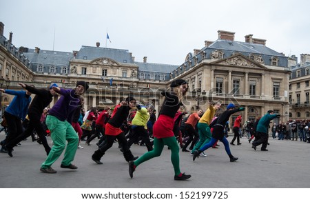 Paris - December 9: People Dance At Palais Royal Square On December 9, 2012 In Paris, France. This Flash Mob Is Held In Memory Of Famous Dancer Dominique Bagouet.
