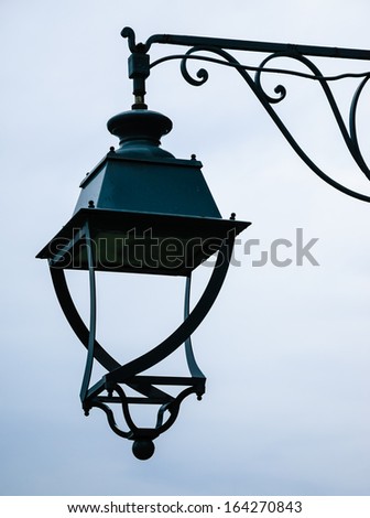 Vintage lantern with water drops after rain. Loneliness concept.