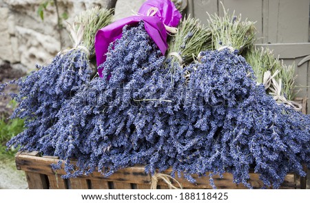 Bouquets of of dry lavender in wooden box. Outdoor. Rural background.