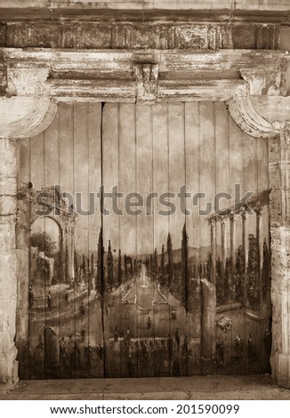 ROUSSILLON, FRANCE - MAY 13, 2013: Painting of French garden with ruins of  Roman temple on door of old house. Roussillon ocher village is included in list of \