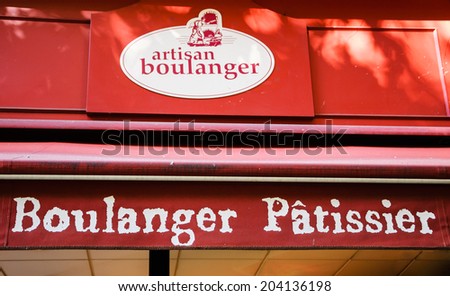 PARIS, FRANCE - JUNE 15, 2014: Typical French pastry and bakery shop sign. Fresh bread is an important component of French daily diet.