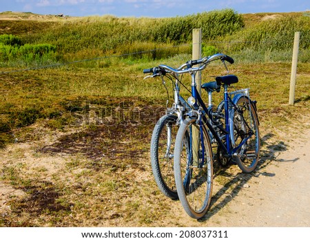 Two bicycles in countryside. Brittany, France. The concept of romance, love and simple everyday life.