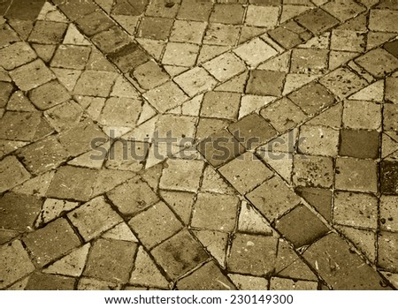 Terracotta tile floor in old house. Aged photo. Sepia.