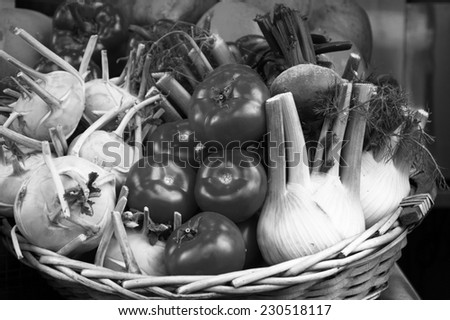 Fresh produce in wicker basket from local farmer\'s market. Mediterranean diet. Aged photo. Black and white.