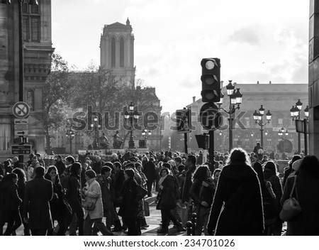 PARIS, FRANCE - NOVEMBER 30, 2013: Shopping crowd near BHV department store located across Hotel de Ville (City Hall). Christmas shopping in Paris starts already in November.