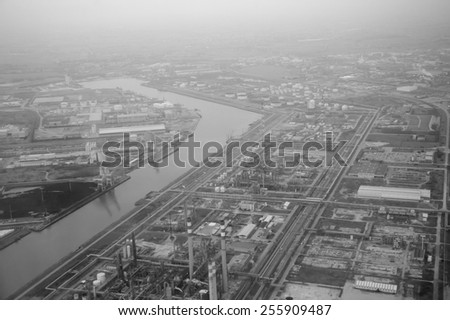 Industry in the fog near the Venice (Italy). View from the air. Aged photo. Black and white.