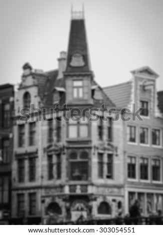 Amsterdam houses and bridge railing. Blurred aged photo. Black and white.