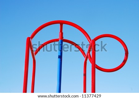 man bending shape monkey bar on blue sky