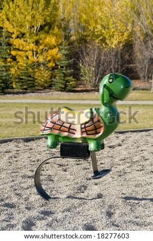 empty turtle toy on playground in fall