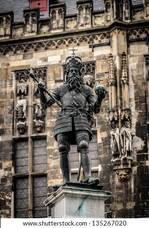 Statue of emperor Charlemagne (Charles the great) in front of the gothic town hall in his home city Aachen in Germany.