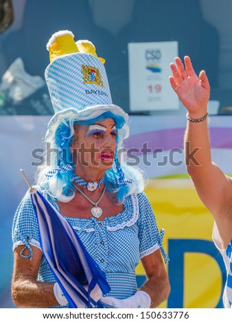 STUTTGART, GERMANY - JULY 27th, 2013 - Man dressed as woman participates at the Christopher Street Day (CSD) parade in Stuttgart circa July 2013. The CSD is an annual LGBT event that ends in a parade.