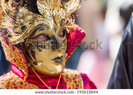 SCHWAEBISCH-HALL, GERMANY - February 23, 2014 - Woman, dressed up in a Venetian style costume with a golden mask attends the Hallia Venetia Carnival festival on February 23, 2014 in SchwÃ?Â¤bisch-Hall.