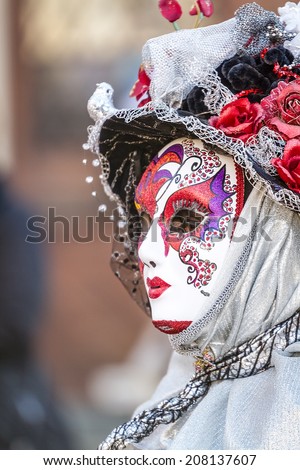 SCHWAEBISCH-HALL, GERMANY - February 23, 2014 - Woman, dressed up in a Venetian style costume with a colorful mask attends the Hallia Venetia Carnival festival on February 23, 2014 in Schwaebisch-Hall.