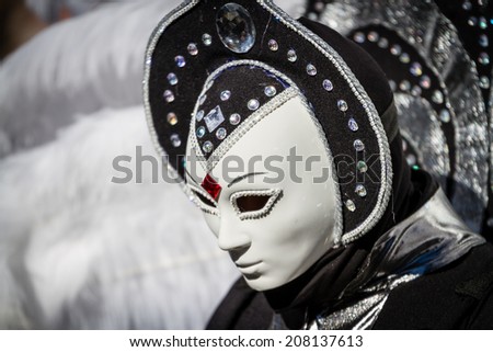 SCHWAEBISCH-HALL, GERMANY - February 23, 2014 - Woman, dressed in a Venetian style costume with an alien-like mask attends the Hallia Venetia Carnival festival on February 23, 2014 in Schwaebisch-Hall.