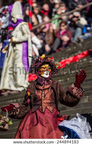 SCHWAEBISCH-HALL, GERMANY - February 23, 2014 - Woman, dressed up in a Venetian style costume as \