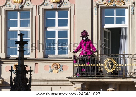 SCHWAEBISCH-HALL, GERMANY - February 23, 2014 - Person, dressed up in a Venetian style costume greets from a balcony at the Hallia Venetia Carnival festival on February 23, 2014 in SchwÃ?Â¤bisch-Hall.