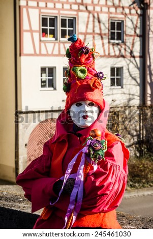SCHWAEBISCH-HALL, GERMANY - February 23, 2014 - Person, dressed up in a Venetian style Joker costume attends the Hallia Venetia Carnival festival on February 23, 2014 in SchwÃ?Â¤bisch-Hall.