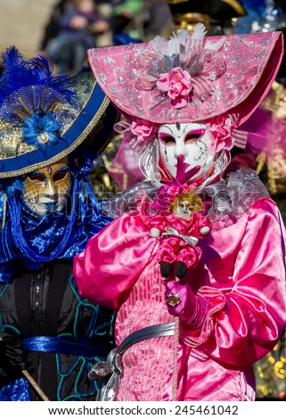 SCHWAEBISCH-HALL, GERMANY - February 23, 2014 - Person, dressed up in a pink Venetian style costume attends the Hallia Venetia Carnival festival on February 23, 2014 in SchwÃ?Â¤bisch-Hall.