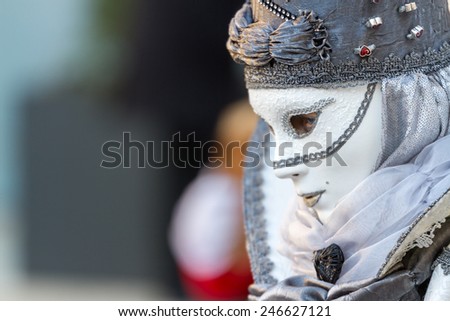 SCHWAEBISCH-HALL, GERMANY - February 23, 2014 - Woman, dressed up in a Venetian style costume with a white mask attends the Hallia Venetia Carnival festival on February 23, 2014 in Schwabisch-Hall.