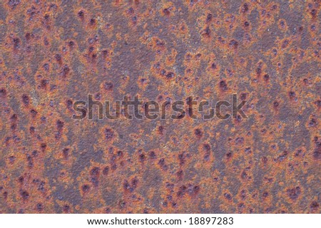 spots on the ferruginous sheet of metal