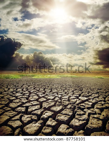 dry lake and dramatic sky with sun