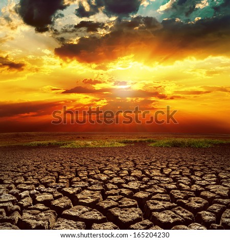 fantastic sunset over cracked earth
