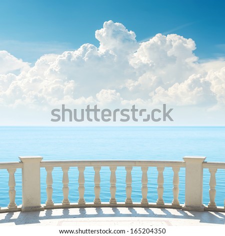 cloudy sky over sea and balcony