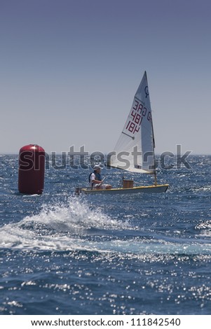 ALEXANDROUPOLI, GREECE - JULY 21: An unidentified sailing athlete at International Summer Regatta sailing action in Mediterranean sea on July 21, 2012 in Alexandroupoli, Greece