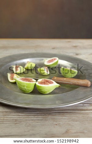 green fresh figs in a metallic plate