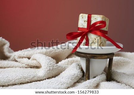 Handmade olive soap with a towel, as a gift.
