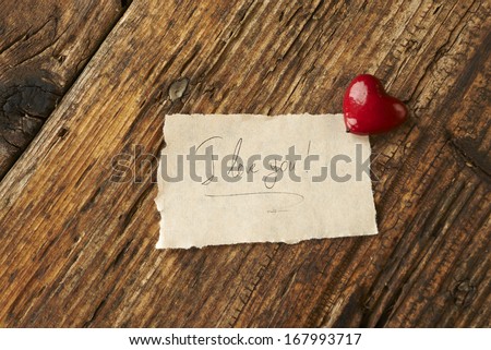Valentines Day, red heart on wooden background.