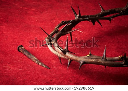 week of passion. Jesus Christ crown of thorns and a nail on red background