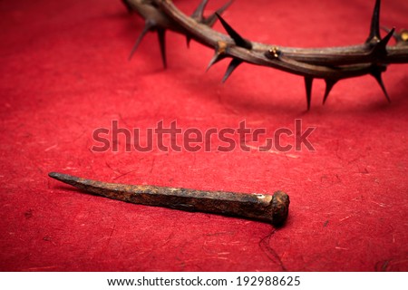 week of passion. Jesus Christ crown of thorns and a nail on red background