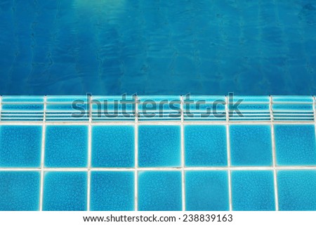 ceramic  floor beside the blue swimming pool, top view