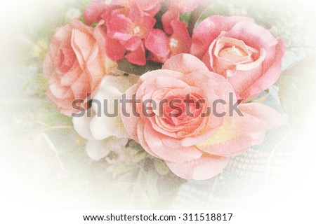 blurred sweet roses bouquet with grunge paper texture