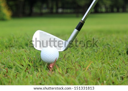 Teeing off in a game of golf, differential focus with copy space
