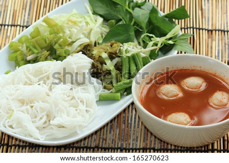 Thai Fish ball curry coconut soup with rice noodles and vegetable