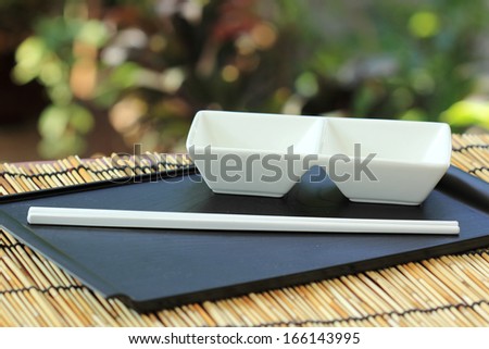 Japanese cup and chopsticks on the wooden Tray