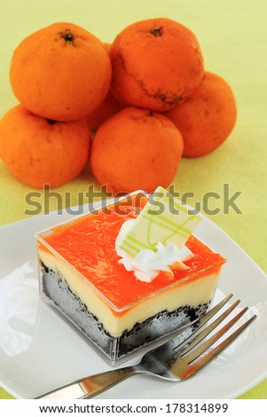 Orange Biscuit cake Layer with cheese cake in Plastic box