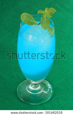 blue hawaiian cocktail on the green table