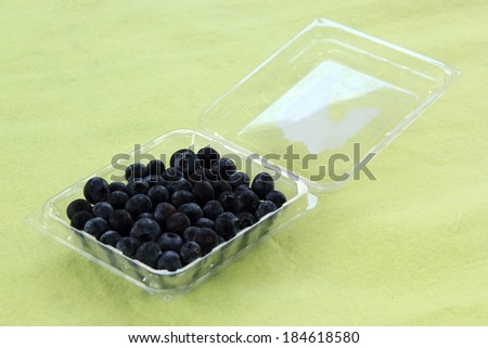 Blueberries in a Plastic Box on the table