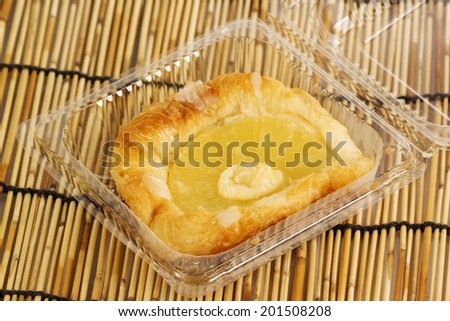 pineapple Danish Pastry in the plastic box