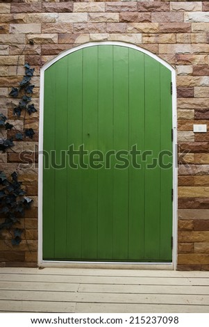 The announcement on the wooden green door.