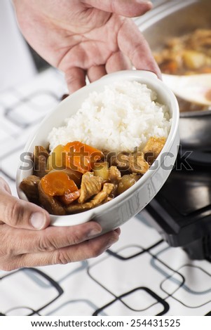 Chef presented Japanese pork curry with steam rice / cooking Japanese pork curry paste concept